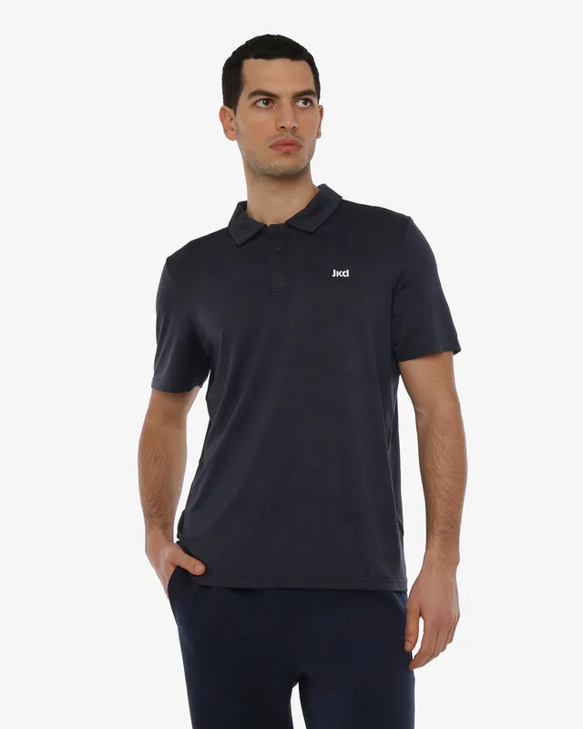 polo-jaked-commuter-con-bottoni-in-materiale-tecnico-traspirante-per-sport-e-tem image 1